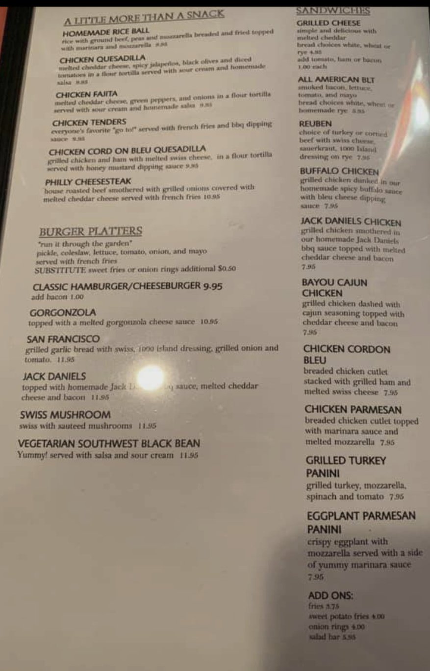 Printed menu with sandwiches and steaks
